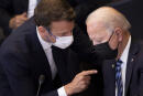 FILE - In this June 14, 2021 file photo, U.S. President Joe Biden, right, speaks with French President Emmanuel Macron during a plenary session during a NATO summit at NATO headquarters in Brussels. French President Emmanuel Macron expects "clarifications and clear commitments" from President Joe Biden in a call to be held later on Wednesday to address the submarines' dispute, Macron's office said. (Brendan Smialowski, Pool via AP, File)
