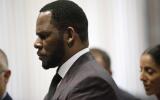 (FILES) In this file photo taken on June 25, 2019 R&amp;B singer R. Kelly appears at a hearing before Judge Lawrence Flood at Leighton Criminal Court Building in Chicago, Illinois. R. Kelly on September 27, 2021 was convicted of leading a decades-long sex crime ring, with a New York jury finding the superstar singer guilty on all nine charges, including racketeering. (Photo by Nuccio DINUZZO / GETTY IMAGES NORTH AMERICA / AFP)