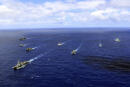 This US Navy photo obtained June 26, 2018 shows vessels from the US Navy, Chilean navy (Armada de Chile), Peruvian navy, French navy (Marine Nationale) and Royal Canadian Navy participating in a photo exercise on June 24, 2018 in the Pacific Ocean. - The participating vessels are scheduled to participate in the biennial Rim of the Pacific (RIMPAC) exercise 2018. (Photo by Steven ROBLES / US NAVY / AFP) / RESTRICTED TO EDITORIAL USE - MANDATORY CREDIT "AFP PHOTO / US NAVY/STEVEN ROBLES" - NO MARKETING NO ADVERTISING CAMPAIGNS - DISTRIBUTED AS A SERVICE TO CLIENTS