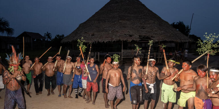 VALE DO JAVARI, BRAZIL - AUGUST 12, 2021: Kanamari men performe the ancient Hai Hai cerimony in Sao Luis village in the Vale do Javari. Contacted in the first half of the 20th century, possibly by rubber tappers or other explorers of the territory's resources, for decades the Kanamari managed to maintain an extraordinary resistance to external influences and persecution. They preserve their language, their ceremonies and their material, immaterial and spiritual culture.