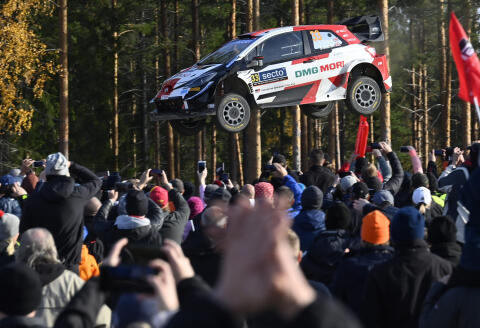 British driver Elfyn Evans and co-driver Scott Martin are airborne with their Toyota during the special stage 19, Ruuhim'ki, at the WRC Rally Finland in Laukaa, Finland, Sunday, Oct. 3, 2021. Evans and Martin won the race. (Jussi Nukari/Lehtikuva via AP)
