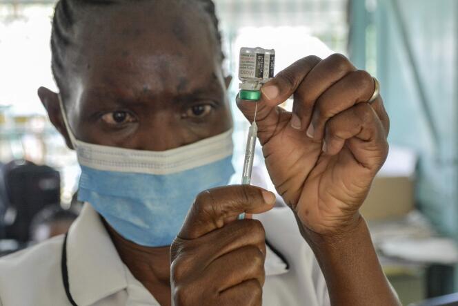 A nurse prepares a dose of malaria vaccine at Yala Sub-County Hospital, Yala, Kenya, October 7, 2021.