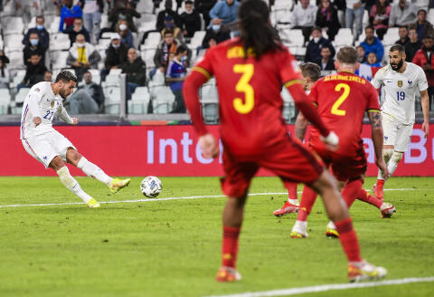 France’s Theo Hernandez, left, scores his side’s third goal during the UEFA Nations League semifinal soccer match between Belgium and France at the Juventus stadium, in Turin, Italy, Thursday, Oct. 7, 2021. (Fabio Ferrari/LaPresse via AP)