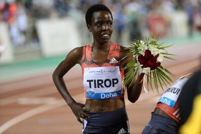 (FILES) In this file photo taken on May 04, 2018 Agnes Jebet Tirop of Kenya celebrates after winning second-place in the women's 3000 metres race during the Diamond League athletics competition at the Suhaim bin Hamad Stadium in Doha. Record-breaking Kenyan distance runner Agnes Tirop was found dead on October 13, 2021 with stab wounds to her stomach in a suspected homicide, athletics officials said. (Photo by KARIM JAAFAR / AFP)