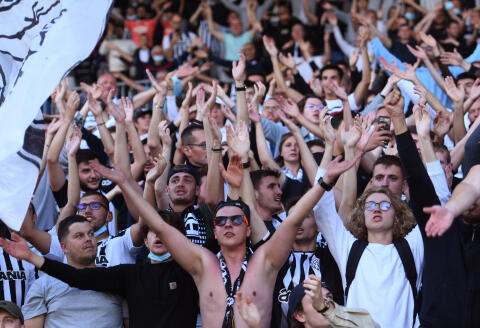 Angers supporters clap during the French L1 football match between SCO Angers and Stade Rennais FC (Rennes) at The Raymond Kopa Stadium in Angers, western France on August 29, 2021. (Photo by Jean-Francois MONIER / AFP)