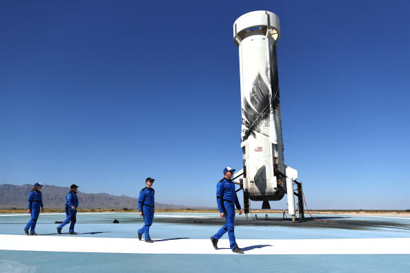 VAN HORN, TEXAS - OCTOBER 13: (L to R) Blue Origin vice president of mission and flight operations Audrey Powers, Star Trek actor William Shatner, Planet Labs co-founder Chris Boshuizen and Medidata Solutions co-founder Glen de Vries walk to a media availability on the landing pad of Blue Origin’s New Shepard after they flew into space on October 13, 2021 near Van Horn, Texas. Shatner became the oldest person to fly into space on the ten minute flight. They flew aboard mission NS-18, the second human spaceflight for the company which is owned by Amazon founder Jeff Bezos.