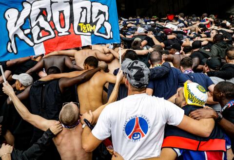 Paris Saint-Germain's ultra-fanatical fans, known as Ultras, attend an away French L1 football match between Paris Saint-Germain (PSG) and Rennes at the Roazhon Park stadium in Rennes, on September 23, 2018. - The most fervent supporters of Paris Saint Germain (PSG) football club, are not limited to the Parc des Princes stadium in Paris. Social commitment, preparation of events and solidarity between members : it's a full-time passion. (Photo by Geoffroy VAN DER HASSELT / AFP)