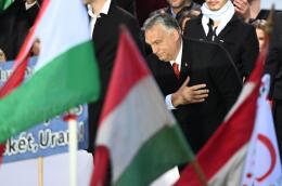 Hungarian Prime Minister Viktor Orban reacts after delivering a speech during an event in Budapest on October 23, to commemorate the 65nd anniversary of Hungarian uprising against Soviet occupation in Budapest on October 23, 2021. Hungarians took to the streets in separate national day demonstrations to voice support for and against Prime Minister Viktor Orban. (Photo by Attila KISBENEDEK / AFP)