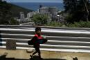 A boy plays with a skateboard made of recycled plastic waste by "Na Laje Designs" project, that helps garbage collectors earn donated food in the Rocinha slum in Rio de Janeiro, Brazil October 22, 2021. Picture taken October 22, 2021. REUTERS/Pilar Olivares