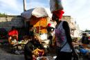 Vendors sit next to their produce at a market, in Port-au-Prince, Haiti October 23, 2021. REUTERS/Claudia Daut