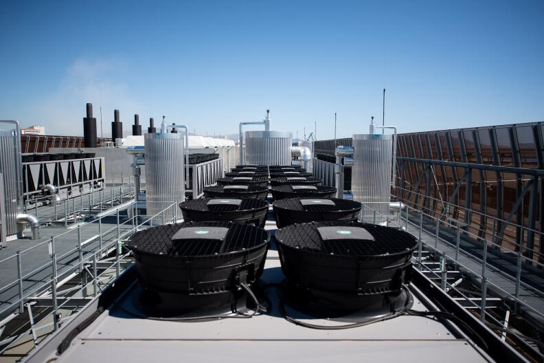 A photograph taken on July 8, 2020 shows cooler installationson the roof of the new MRS3 Interxion datacenter, settled in a former submarine base built by the Germans during the Second World War, in Marseille harbour, southern France. - A data centre of the American group Digital Realty / Interxion opened on July 1, 2020 a "global digital hub" in a former submarine base of the German army during the Second World War in the port of Marseille, southern France. (Photo by CLEMENT MAHOUDEAU / AFP)