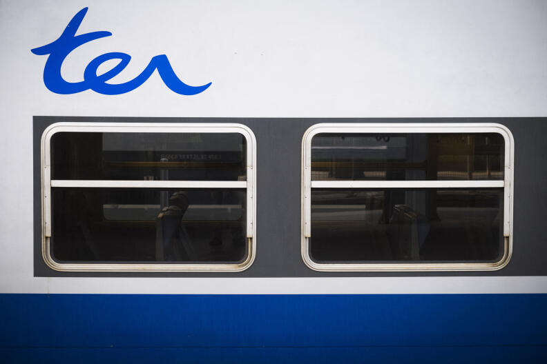 The logo of regional express train (TER) is seen on a train on February 24, 2018 at the Gare du Nord railway station in Paris. (Photo by JOEL SAGET / AFP)