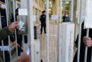 A picture taken on May 20, 2021 at the criminal court of Montpellier, southern France shows the entrance gate prior to the opening of the trial of the former dean of the Faculty of Law and Political Science along with six others for a 'commando' operation carried out in 2018. - On March 22, 2018, a hooded 'commando' armed with batons and an electric pulse pistol, expelled from an amphitheatre of the Montpellier University law school students and activists who were protesting against the reform of access to the university, resulting in 10 minor injuries. (Photo by Sylvain THOMAS / AFP)