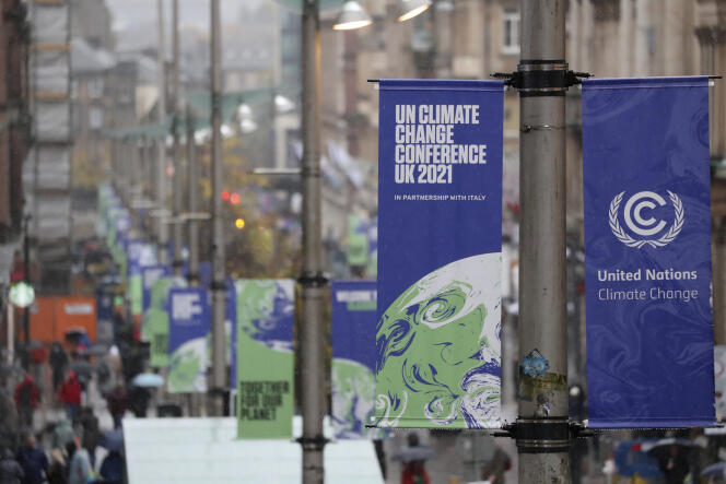 Banners announcing the presence of COP26, in central Glasgow, Scotland, on October 29, 2021.