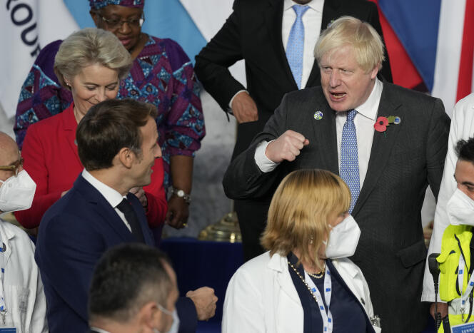 British Prime Minister Boris Johnson greets French President Emmanuel Macron in Rome during the G20 summit on October 30, 2021.