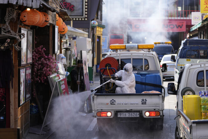 Health departments disinfect storefronts as a precaution in Seoul, South Korea on Friday, October 29, 2021.