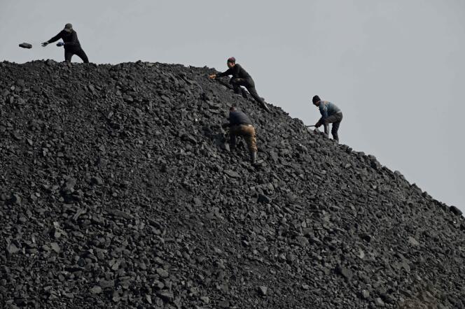 Coal sorting near a mine in Datong, northern China's Shanxi Province, November 2, 2021.