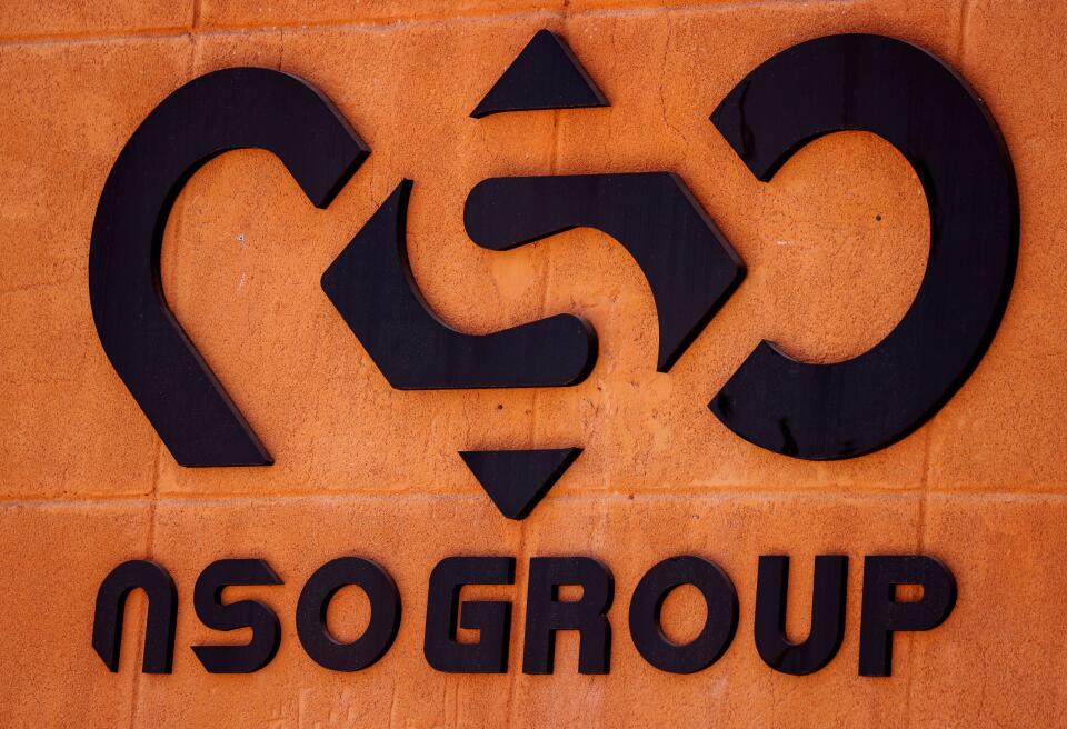 FILE PHOTO: The logo of Israeli cyber firm NSO Group is seen at one of its branches in the Arava Desert, southern Israel July 22, 2021. REUTERS/Amir Cohen/File Photo