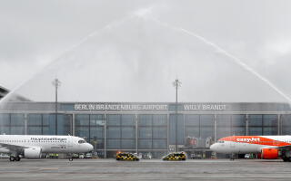 FILE PHOTO: A Lufthansa aircraft and an EasyJet aircraft stand on the tarmac after landing at Terminal 1, marking the official opening of the new Berlin-Brandenburg Airport (BER) "Willy Brandt", in Schoenefeld near Berlin, Germany October 31, 2020. REUTERS/Fabrizio Bensch/File Photo