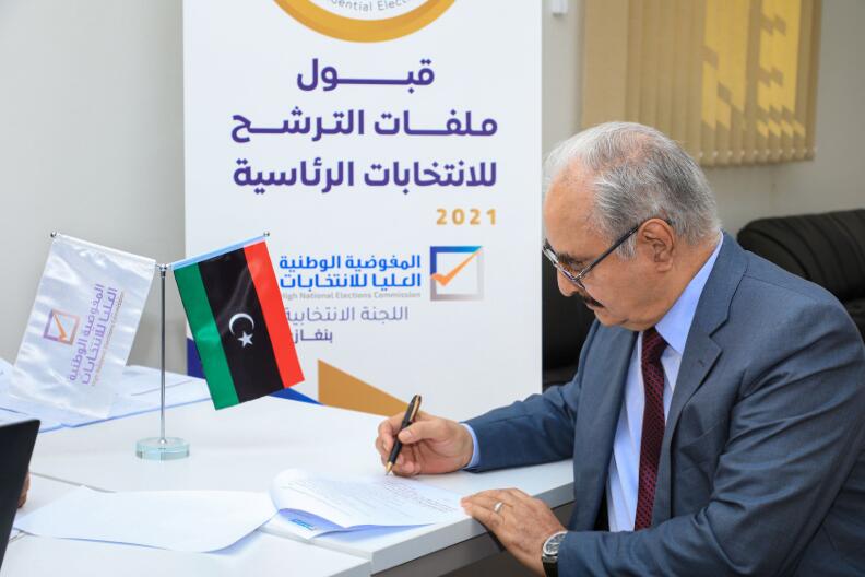 Libya's eastern commander Khalifa Haftar signs his candidacy papers for the presidential elections at the office of the High National Elections Commission, in Benghazi, Libya, November 16, 2021. Khalifa HaftarÕs Media Office /Handout via REUTERS ATTENTION EDITORS - THIS IMAGE WAS PROVIDED BY A THIRD PARTY