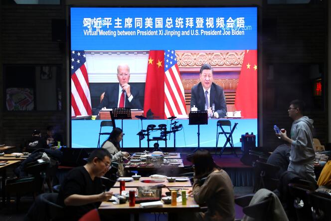 Joe Biden and Xi Jinping during an interview broadcast at a restaurant in Beijing, November 16, 2021.