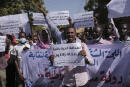 Sudanese journalist protest in Khartoum, Sudan, Tuesday, Nov.16, 2021. The placard in the middle reads: "free press will remain, tyrants are fleeting" (AP Photo/Marwan Ali)