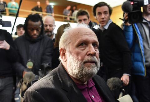 (FILES) This file photo taken on January 13, 2020 shows Bernard Preynat, a former priest accused on sexual assaults, waiting at the beginning of his trial in the courthouse of Lyon, southeastern France. Former priest Bernard Preynat, sentenced in 2020 to five years in prison for sexual assaults on minors committed between 1971 and 1991 in the diocese of Lyon, was arrested on November 17, 2021 morning in the Loire to serve his sentence, AFP learned from a police source. (Photo by PHILIPPE DESMAZES / AFP)