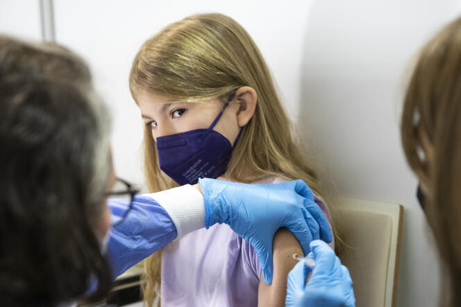 A young girl receives an injection of Pfizer vaccine in Vienna, Austria, November 15, 2021.