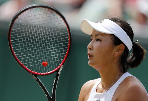 (FILES) This file photo taken on July 7, 2017 shows China's Peng Shuai Romania's reacting against Simona Halep during their women's singles third round match on the fifth day of the 2017 Wimbledon Championships at The All England Lawn Tennis Club in Wimbledon, southwest London. China's former vice premier Zhang Gaoli (2013-18) has been accused by tennis champion Peng Shuai of forcing her to have sex during a long-term on-off relationship, in a message promptly censored on Chinese social networks. - TO GO WITH Tennis-CHN-China-politics-Zhang,PROFILE by Patrick BAERT
RESTRICTED TO EDITORIAL USE (Photo by Adrian DENNIS / AFP) / TO GO WITH Tennis-CHN-China-politics-Zhang,PROFILE by Patrick BAERT
RESTRICTED TO EDITORIAL USE