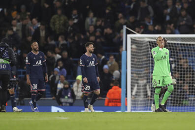 PSG's, from left, Neymar, Lionel Messi, goalkeeper Keylor Navas and Danilo Pereira walk off the pitch at the end of the Champions League group A soccer match between Manchester City and Paris Saint-Germain at the Etihad Stadium in Manchester, England, Wednesday, Nov. 24, 2021. (AP Photo/Scott Heppell)