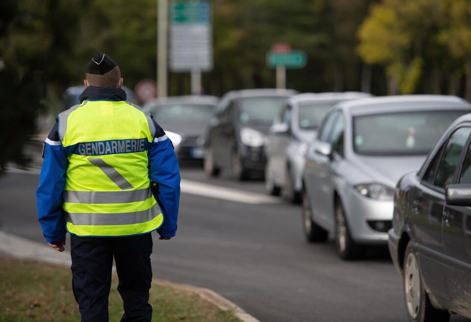 A French gendarme waits to control cars during police checks in Guer, western France on September 29, 2020. (Photo by LOIC VENANCE / AFP)