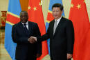 China's President Xi Jinping (R) shakes hands with Democratic Republic of Congo's President Joseph Kabila (L) at the Great Hall of the People in Beijing on September 4, 2015. Kabila is in the Chinese capital after attending a huge military ceremony on September 3 marking the 70th anniversary of Japan's defeat in World War II. AFP PHOTO / POOL / Lintao Zhang (Photo by LINTAO ZHANG / POOL / AFP)