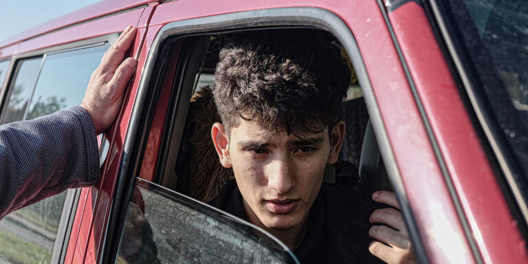 Mustafa, 15, Syrian refugee from Daraa, speaking to Krzyszto Boczek, OKO Press journalist. Mustafa was separated from his father when crossing the Polish-Belarusian border. He was found in the forest by a local villager who contacted volunteers from Granica Group. Hajnówka, Poland, Oct, 31, 2021.
