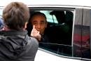 French far-right media pundit Eric Zemmour gestures towards a woman who insulted him as he leaves in his car after a visit in Marseille, southern France, on November 27, 2021. Eric Zemmour, who is due to announce his candidacy for the presidential election in the next few days, made a last eventful visit to Marseille on November 26, a city he described as "the anti-example" and "disintegrated by immigration". (Photo by Nicolas TUCAT / AFP)