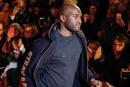 (FILES) This file photo taken on January 17, 2018 shows US fashion designer Virgil Abloh acknowledging applause following the presentation of the men's Fall/Winter 2018/2019 collection he designed for Off White, in Paris. US designer and artistic director of Louis Vuitton's men's collections Virgil Abloh died on November 28, 2021 of cancer at the age of 41, according to the LVMH group. (Photo by FRANCOIS GUILLOT / AFP)