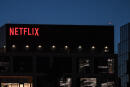 The Netflix logo is seen on the Netflix, Inc. building on Sunset Boulevard in Los Angeles, California on October 19, 2021. - Netflix reported billion-dollar profits and booming subscriber growth on October 19 that beat forecasts as global hits like Squid Game drew viewers in droves. (Photo by Robyn Beck / AFP)