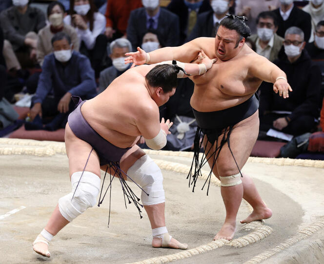 Wrestler Terunofuji Haruo (left) winner of Takakeish? Mitsunobu at the Kyushu basho sumo tournament in Fukuoka on November 28, 2021.