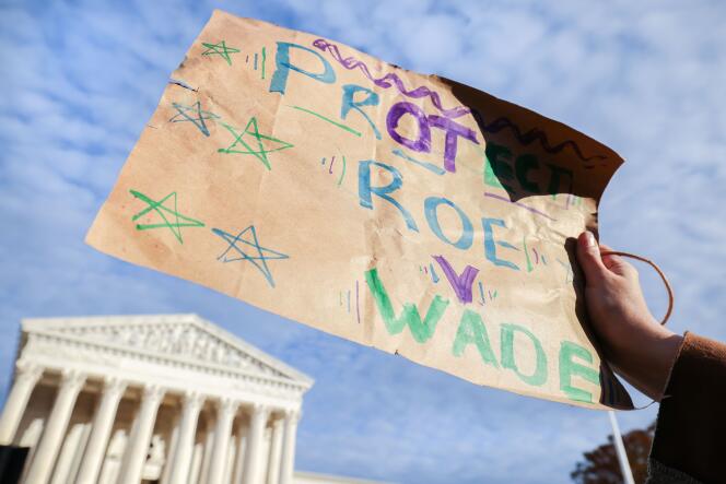 A person calls to protect the right to abortion, during a demonstration outside the Supreme Court in Washington, December 1, 2021.