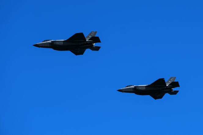 Two U.S. Air Force Lockheed Martin F-35 fighter jets fly over Howlgate Beach (Calvados) on June 6, 2021.