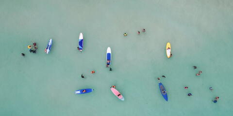 People paddle along White Beach in Boracay Island amid the coronavirus disease (COVID-19) outbreak, in Aklan province, Philippines, December 1, 2021. Picture taken with a drone. REUTERS/Eloisa Lopez