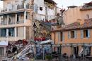 French firefighters search the rubble for missing inhabitants after a building collapsed in Sanary-sur-Mer, on December 7, 2021. Five people are "probably trapped in the rubble" of a three-story apartment building that collapsed overnight in Sanary-sur-Mer, Var, following an explosion that may have been caused by a gas problem, according to the firefighters. (Photo by Nicolas TUCAT / AFP)