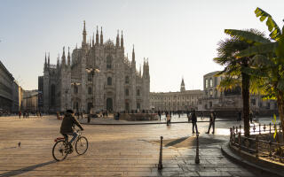 People passing by in Piazza del Duomo in the morning, Milan, Lombardy region, Italy.