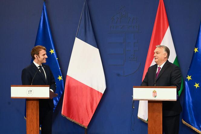 French President Emmanuel Macron (L) and Hungarian Prime Minister Viktor Orban address a joint press conference in Budapest on December 13, 2021.