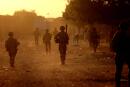 (FILES) In this file photo taken on December 04, 2021 French soldiers patrol the streets of Gao on December 4, 2021. France's anti-jihadist military force in the Sahel region, which today involves over 5,000 troops, will end in the first quarter of 2022. (Photo by Thomas COEX / AFP)