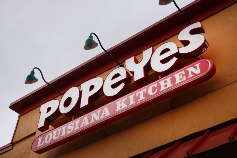 CHICAGO, ILLINOIS - MAY 06: A sign hangs outside of a Popeyes Louisiana Kitchen restaurant on May 06, 2021 in Chicago, Illinois. Chicken prices have risen sharply this year as suppliers struggle to keep up with demand, fueled in part, by the popularity of new chicken offerings from fast-food restaurants. Scott Olson/Getty Images/AFP (Photo by SCOTT OLSON / GETTY IMAGES NORTH AMERICA / Getty Images via AFP)
