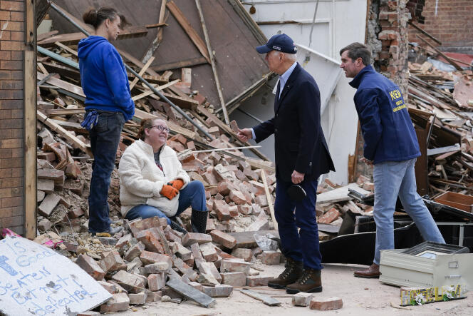 U.S. President Joe Biden and Kentucky Governor Andy Beshear speak with disaster victims in Mayfield on December 15, 2021.