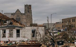 MAYFIELD, KENTUCKY - DECEMBER 15: Debris is piled up next to destroyed buildings on December 15, 2021 in Mayfield, Kentucky. Multiple tornadoes struck several Midwest states late evening on December 10, causing widespread destruction and multiple fatalities. Brandon Bell/Getty Images/AFP == FOR NEWSPAPERS, INTERNET, TELCOS &amp; TELEVISION USE ONLY ==