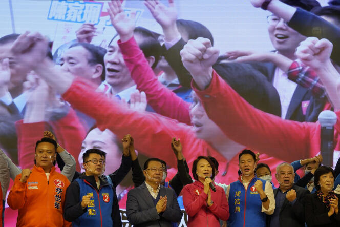 Democratic Alliance for the Betterment and Progress of Hong Kong party chair Starry Lee Wai-king (center) at a campaign rally in Hong Kong on December 5, 2021.