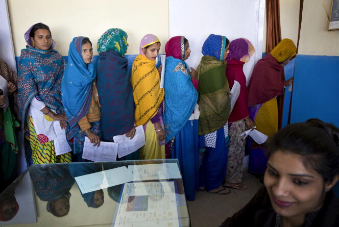 Women wait for tests before sterilization surgery at a public hospital in Mahendragarh, India, February 4, 2016.