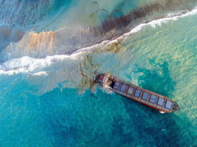 Aerial view, on August 15, 2020, of the ship aground three weeks previously in Mauritian waters, and the released oil slick.
